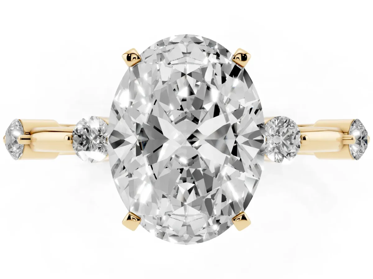 Oval Cut Solitaire Diamond Ring with Bezel Set Side Stones and Prong Setting Yellow gold