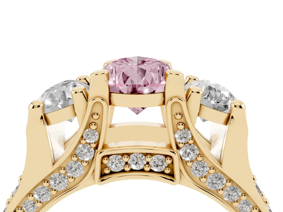 Fancy Pink Pear Cut Diamond Three-Stone Ring with Channel Set Band and Four-Prong Setting Yellow gold