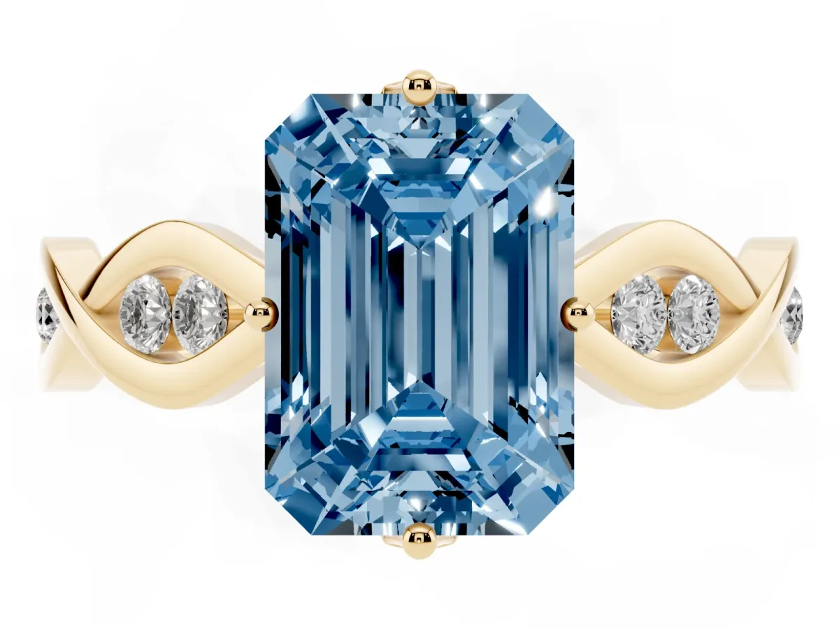 Fancy Blue Emerald Cut Solitaire Twist Band with Leaf Prong Setting Yellow gold