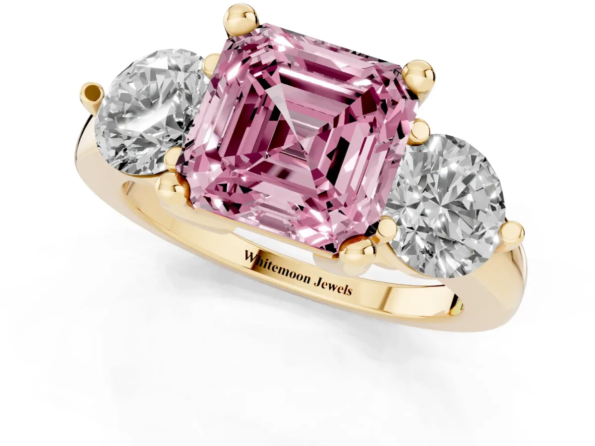 Fancy Pink Three-Stone Asscher Cut Brilliant Cut Solitaire Ring with Prong Setting on a Classic Band Yellow gold