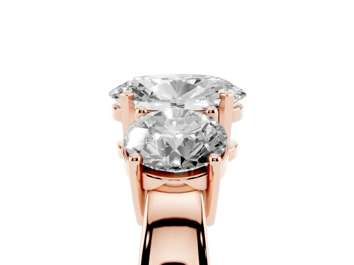 Three-Stone Oval Cut Diamond Ring with Round Side Stones, Classic Band, and Four-Prong Setting Rose gold