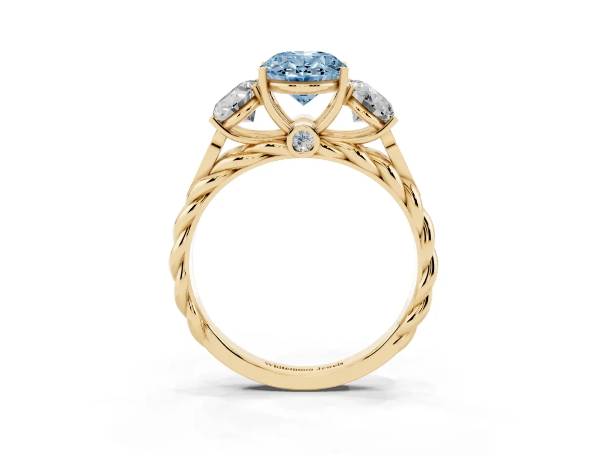 Fancy Blue Three-Stone Oval Cut Diamond Braided Band Ring with Four-Prong Setting Yellow gold