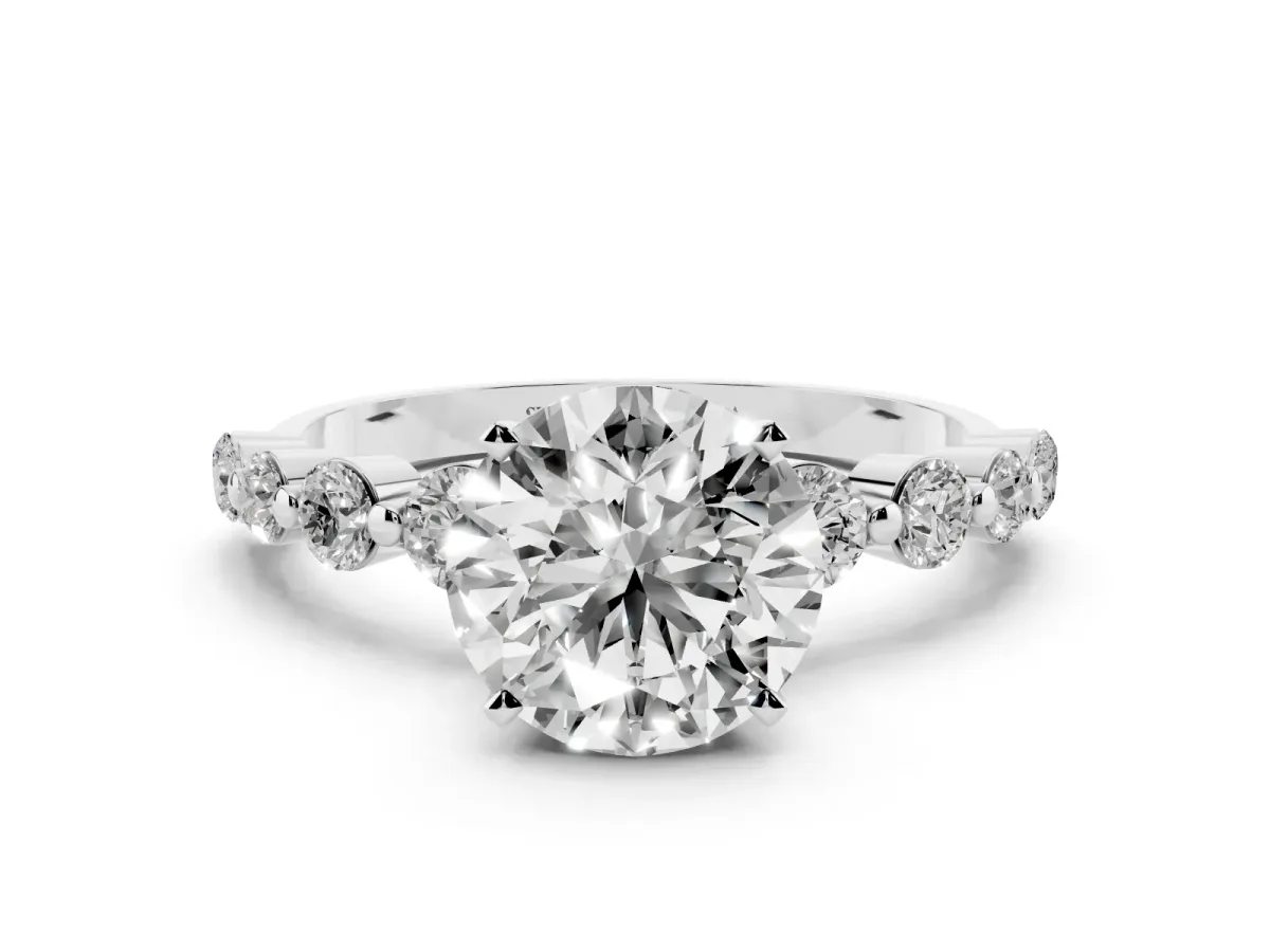 Round Cut Solitaire Diamond Ring with Pave Band and Four-Prong Setting Silver
