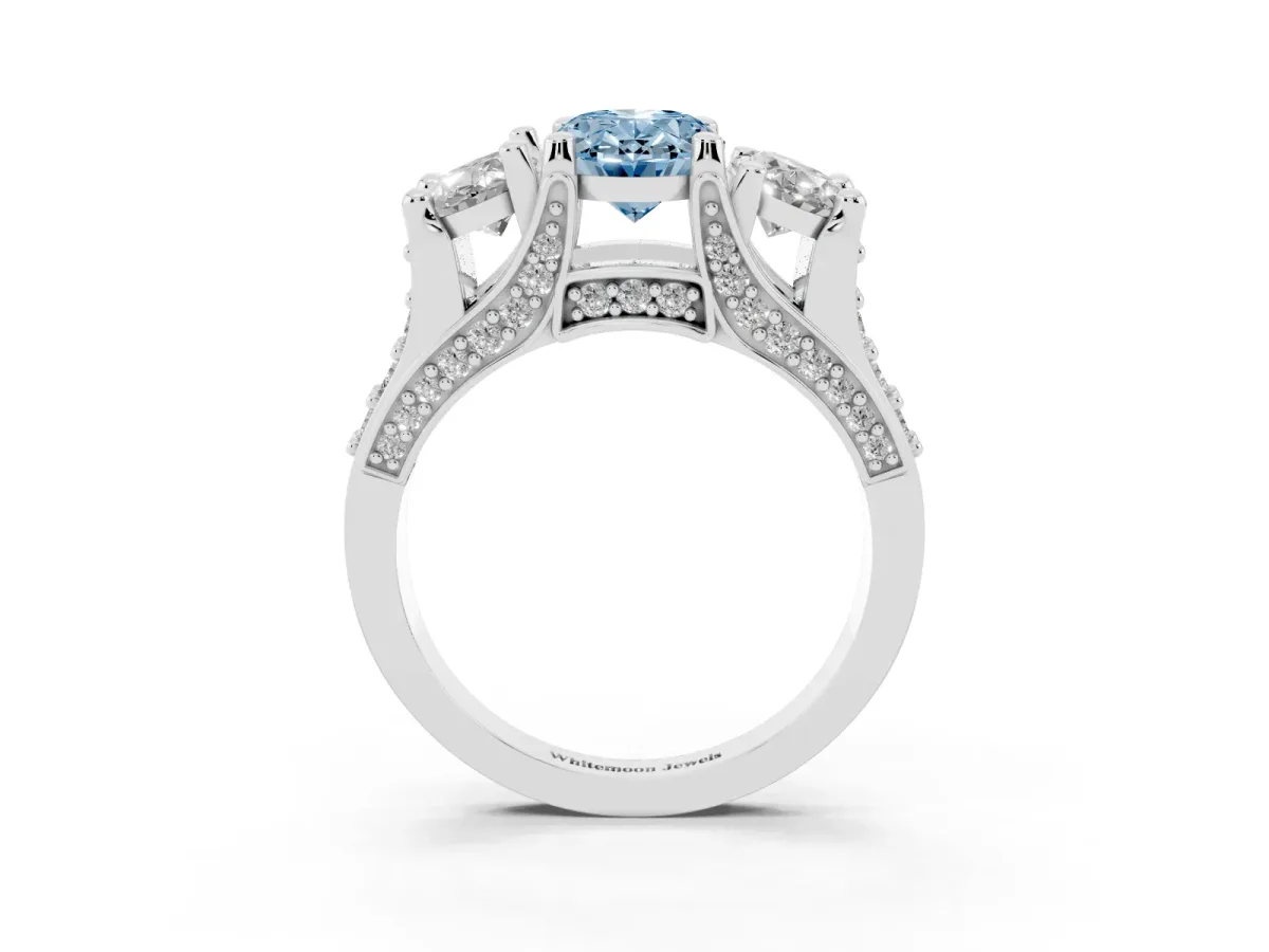 Fancy Blue Oval Cut Diamond Three-Stone Ring with Channel Set Band and Four-Prong Setting Silver