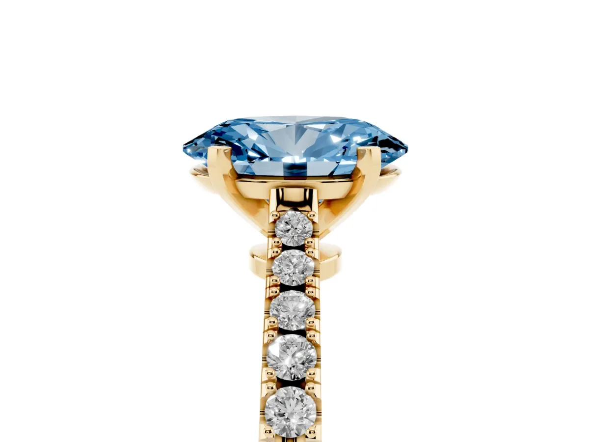 Fancy Blue Oval Cut Cut Solitaire Diamond Engagement Ring with Pave Band and Four-Prong Setting Yellow gold