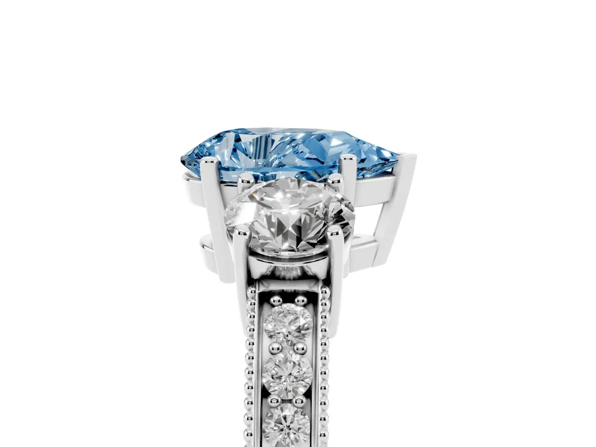 Fancy Blue Pear Cut Three-Stone Diamond Ring with Pavé Band and Four-Prong Setting Silver