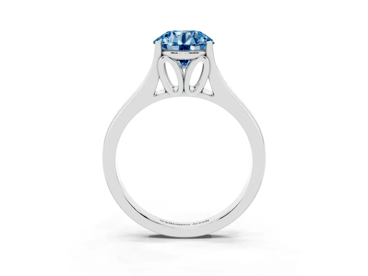 Fancy Blue Round Cut Solitaire Diamond Ring with Cathedral Band and Four-Prong Setting Silver
