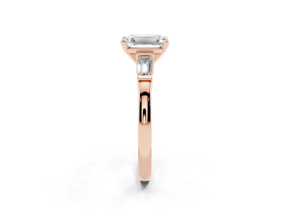 Emerald Cut Cut Diamond Solitaire Ring with Tapered Baguette Accents and Four-Prong Setting Rose gold