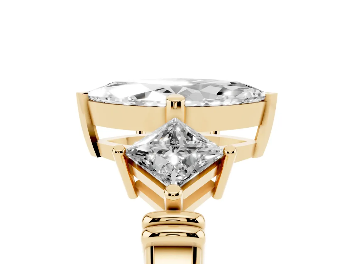 Three-Stone Marquise Cut and Princess Cut Diamond Ring with Channel Band and Four-Prong Setting Yellow gold