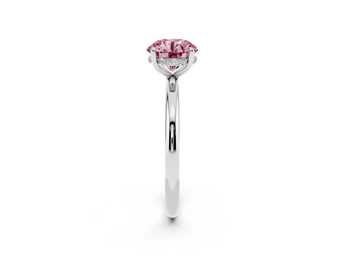 Fancy Pink Round Cut Diamond Solitaire Ring with Thin Band and Four-Prong Setting Silver