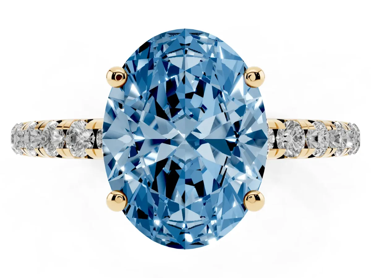 Fancy Blue Oval Cut Cut Diamond Solitaire Ring with Micro Pave Band and Four Prong Setting Yellow gold