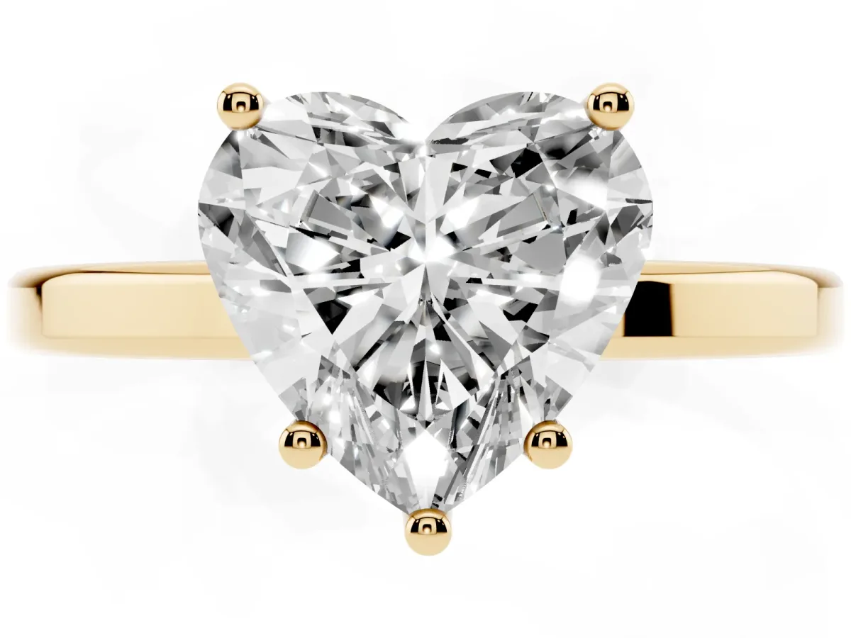 Heart Cut Cut Solitaire Engagement Ring with Four-Prong Setting on a Classic Band Yellow gold