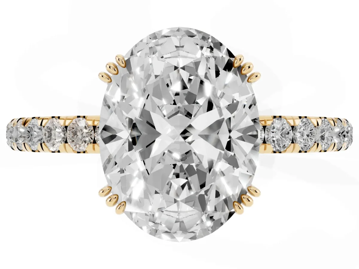 Oval Cut Brilliant Solitaire with Pavé Band and Claw Prong Setting Yellow gold