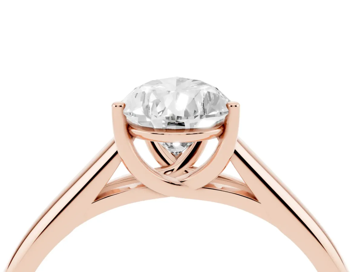 Pear Cut Solitaire Engagement Ring with Tapered Band and Four-Prong Setting Rose gold