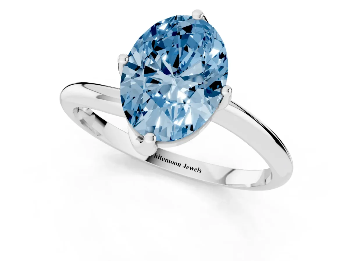 Fancy Blue Oval Cut Diamond Solitaire Engagement Ring with Four-Prong Setting and Classic Band Platinum