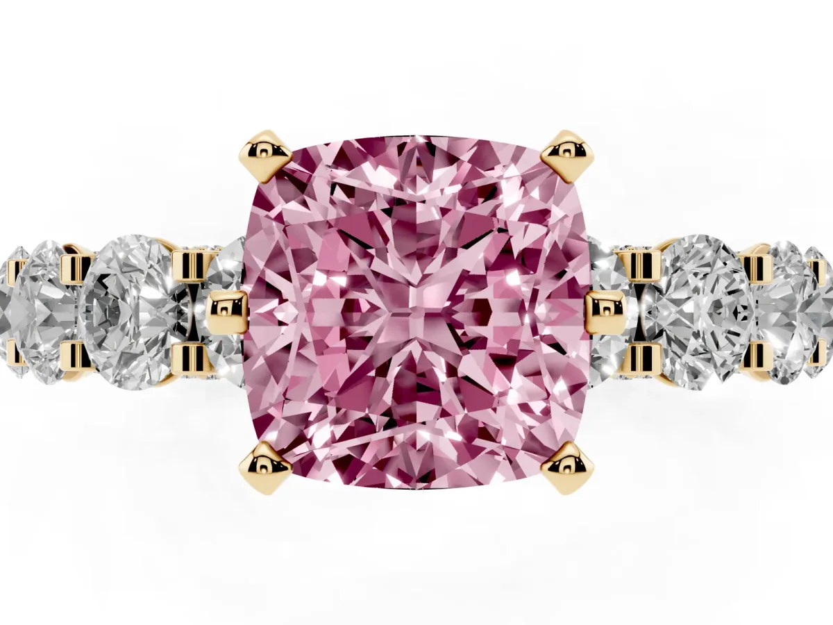 Fancy Pink Cushion Cut Diamond Side Stone Engagement Ring with Four-Prong Setting Yellow gold