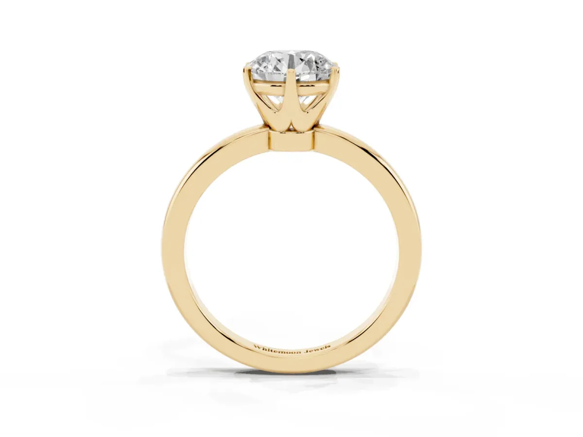 Round Cut Solitaire Diamond Ring with Six-Prong Setting on a Classic Band Yellow gold