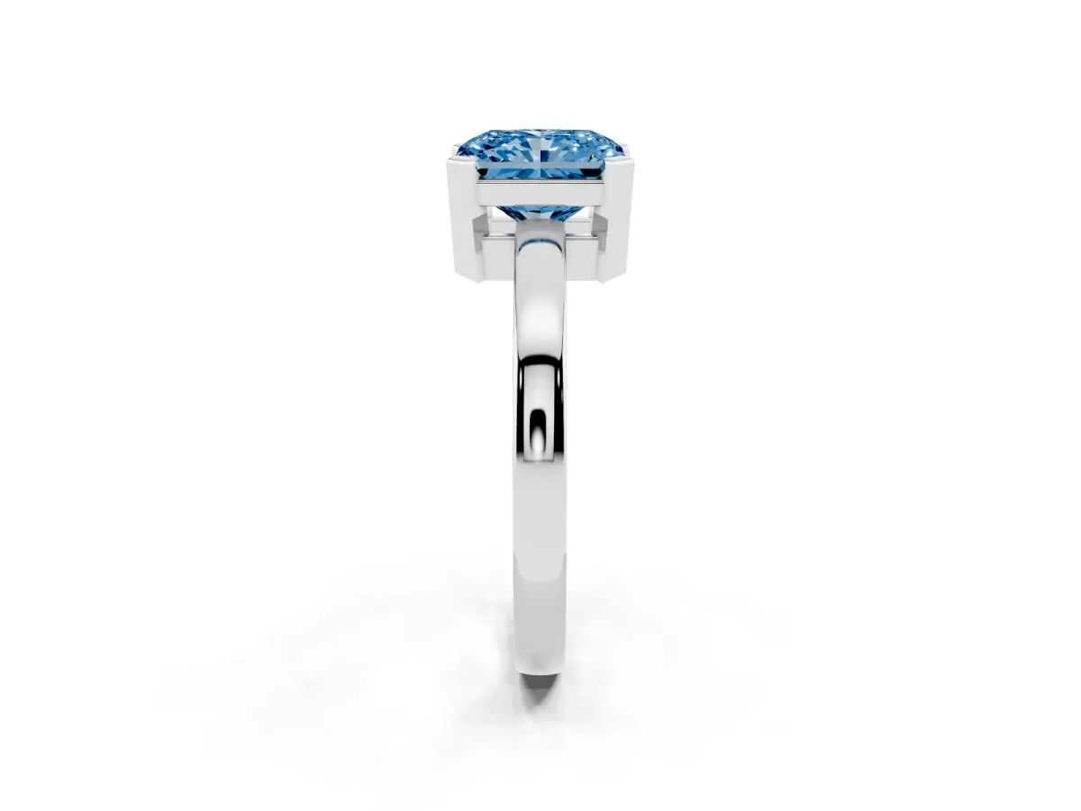 Fancy Blue Radiant Cut Cut Solitaire Ring with Four-Prong Setting and Classic Band Silver