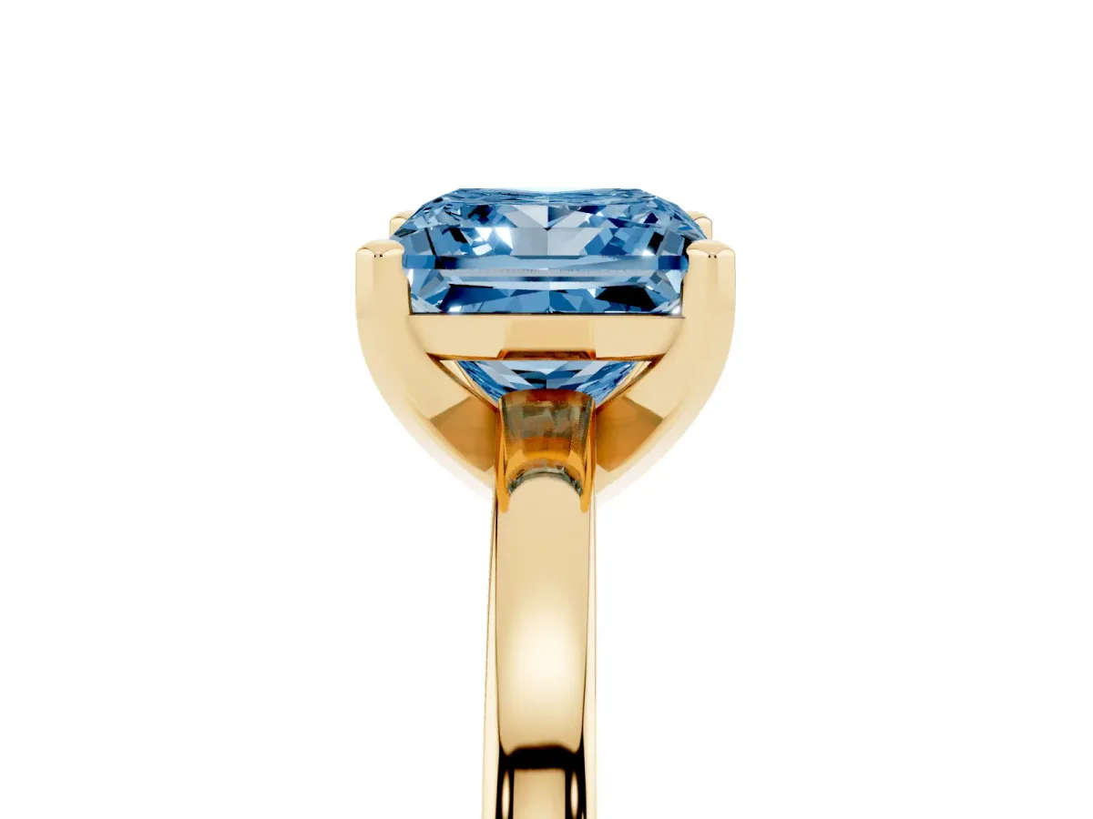 Fancy Blue Princess Cut Solitaire Diamond Engagement Ring with Four-Prong Setting on a Classic Band Yellow gold