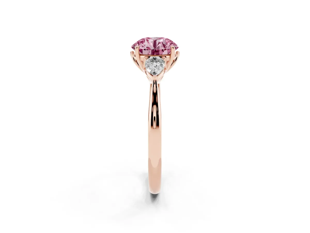 Fancy Pink Round Cut Diamond Three-Stone Ring with Pear Side Stones and Prong Setting Rose gold