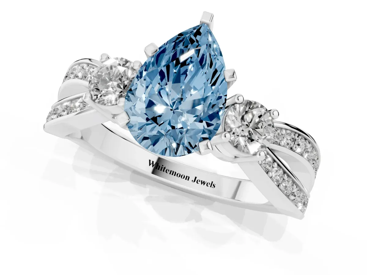 Fancy Blue Three-Stone Pear Cut Cut Diamond Twist Band with Prong Setting Platinum