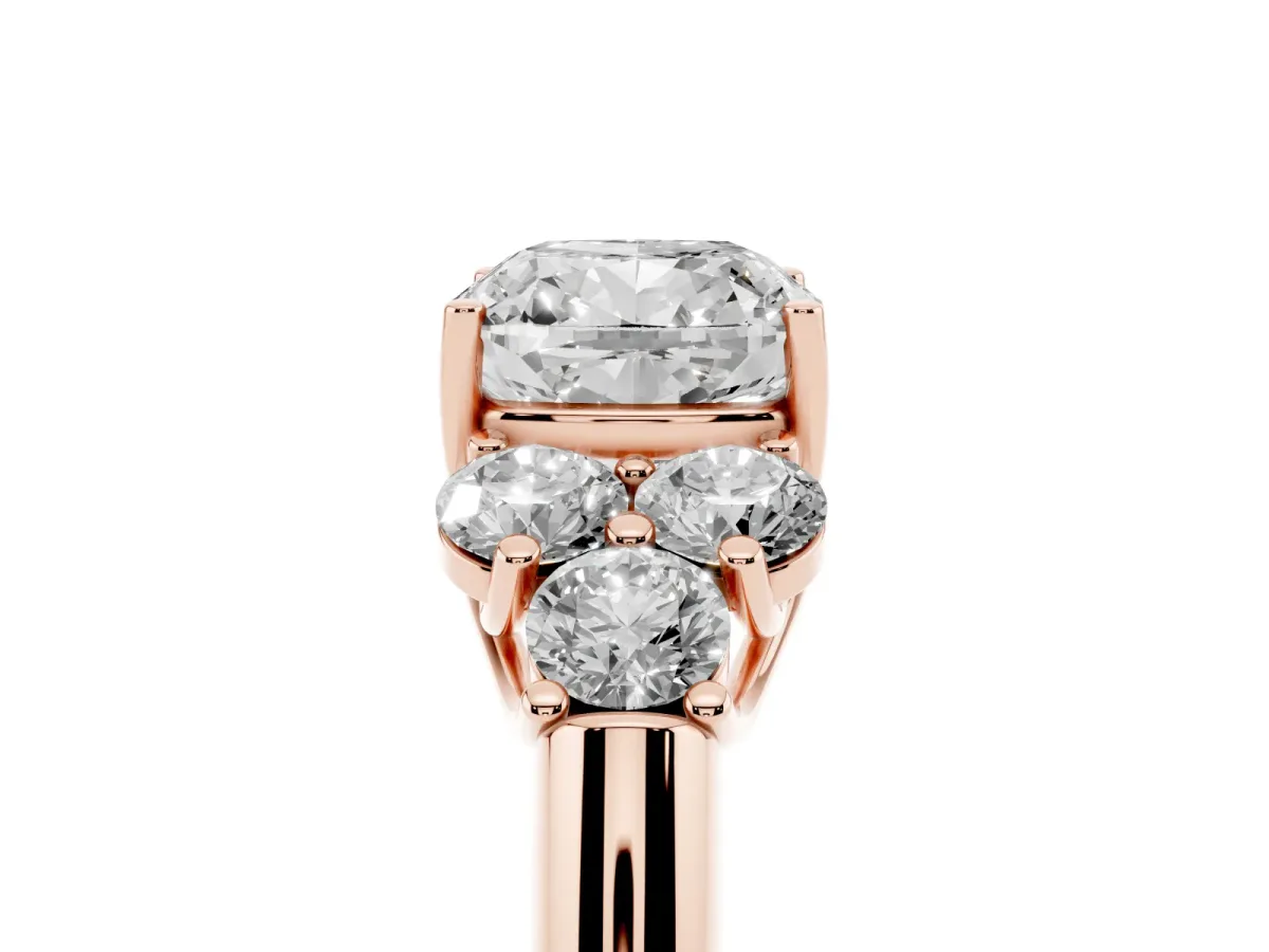 Cushion Cut Cut Diamond Cluster Ring with Round Accent Stones and Prong Setting on a Classic Band Rose gold