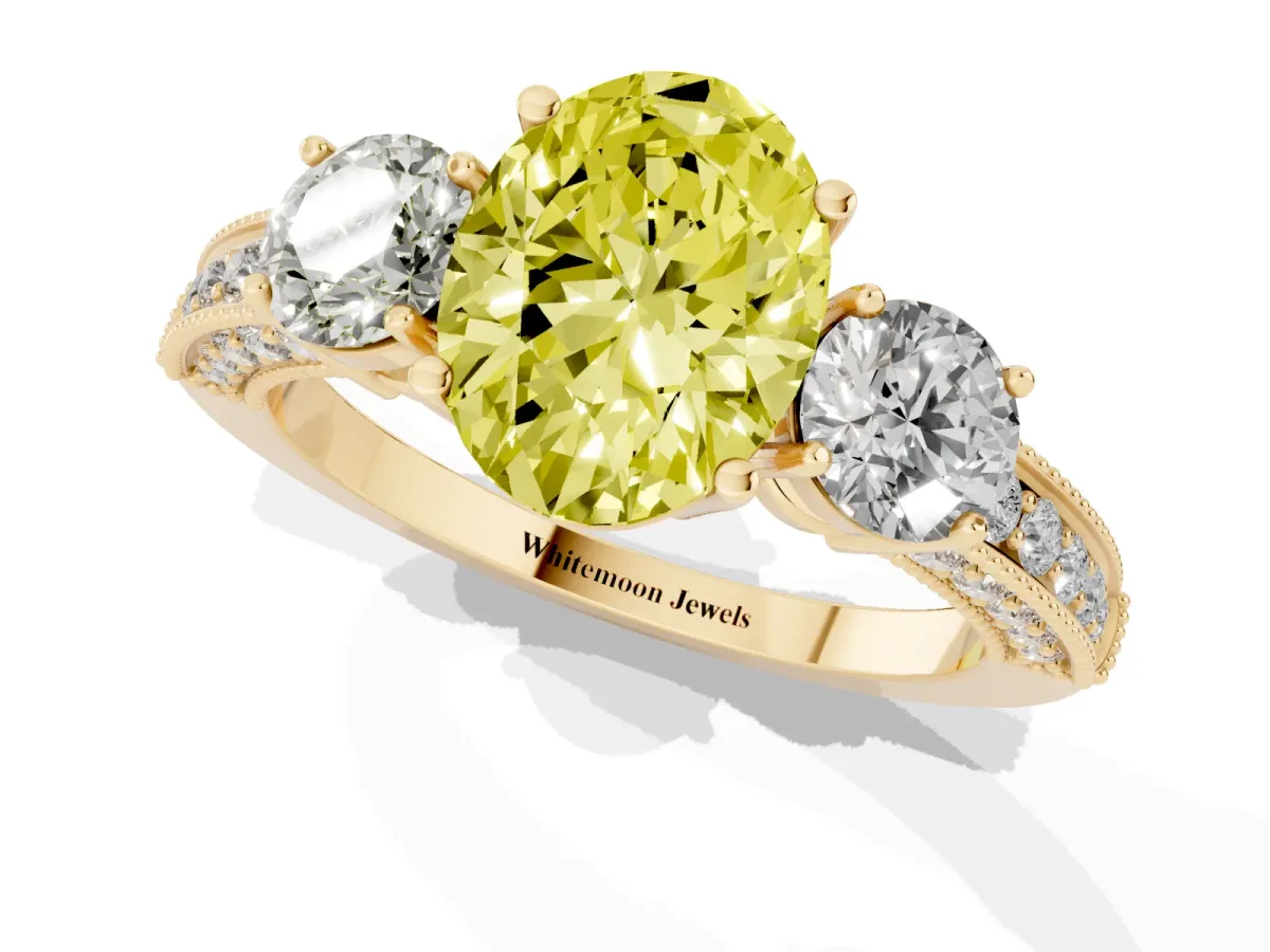 Fancy Yellow Oval Cut Three-Stone Diamond Ring with Pavé Band and Four-Prong Setting Yellow gold