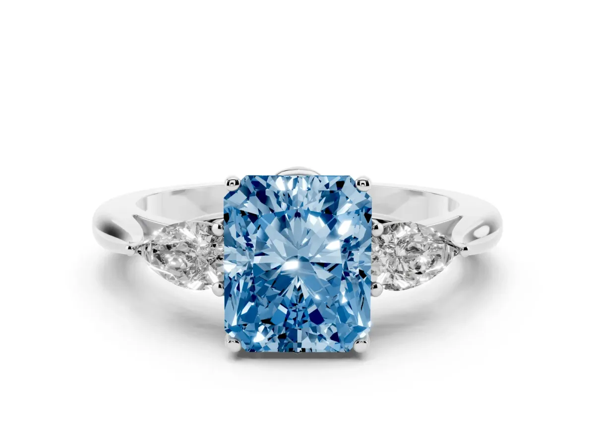 Fancy Blue Three-Stone Radiant Cut Diamond Ring with Pear Side Stones in Four-Prong Setting Platinum