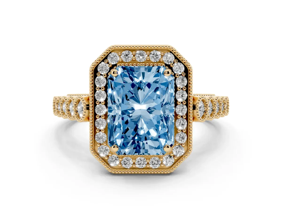 Fancy Blue Radiant Cut Halo Milgrain Solitaire with Bezel Set Side Stones and Pave Band Yellow gold