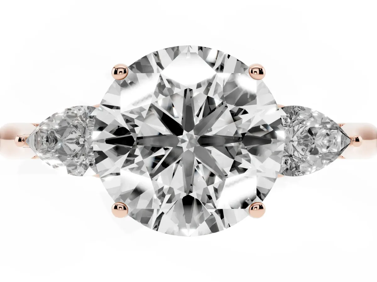 Three-Stone Round Cut Diamond Ring with Pear Side Stones in Four-Prong Setting Rose gold