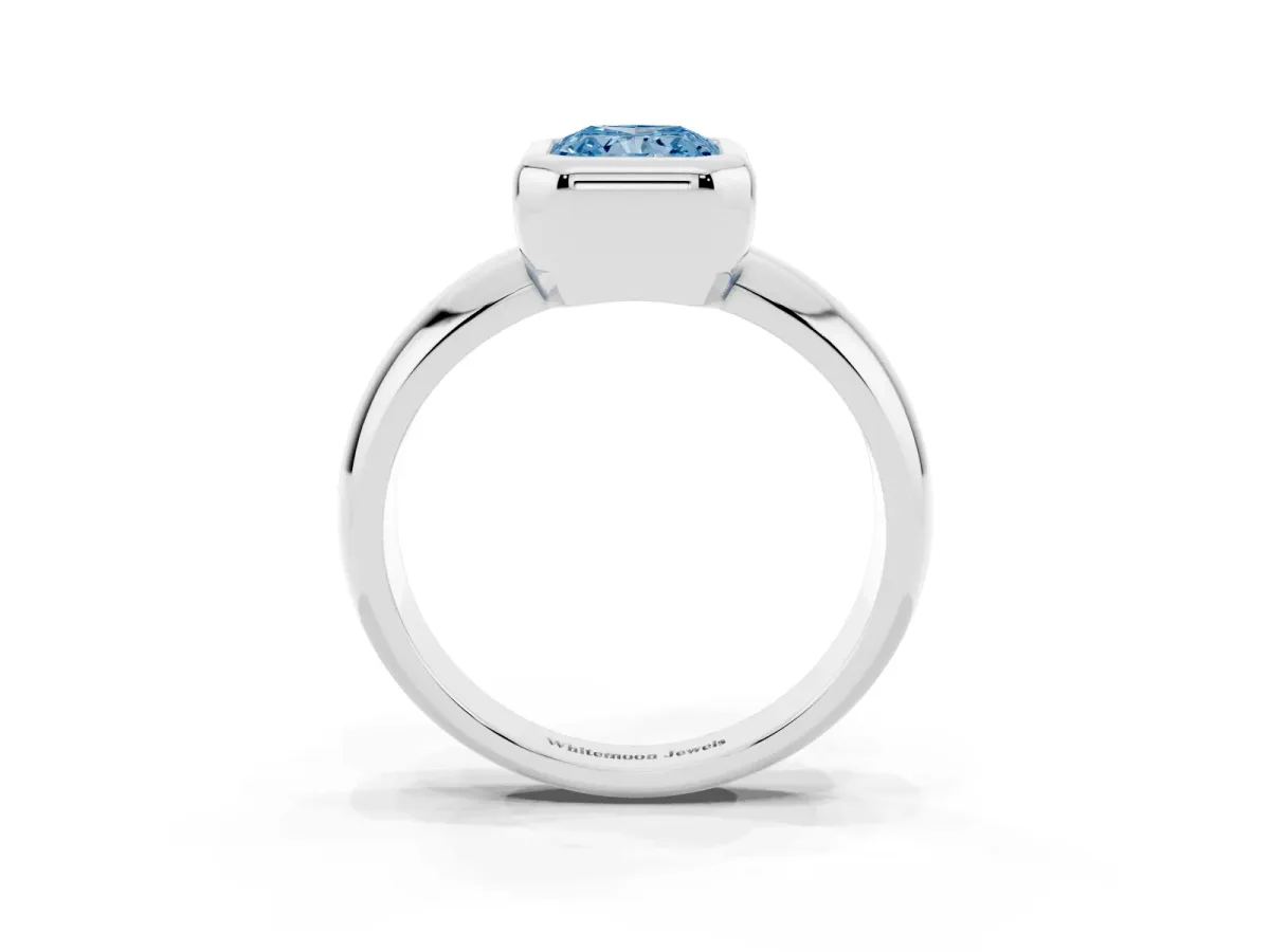 Fancy Blue Bezel Set Radiant Cut Solitaire Ring with Wide Band Silver