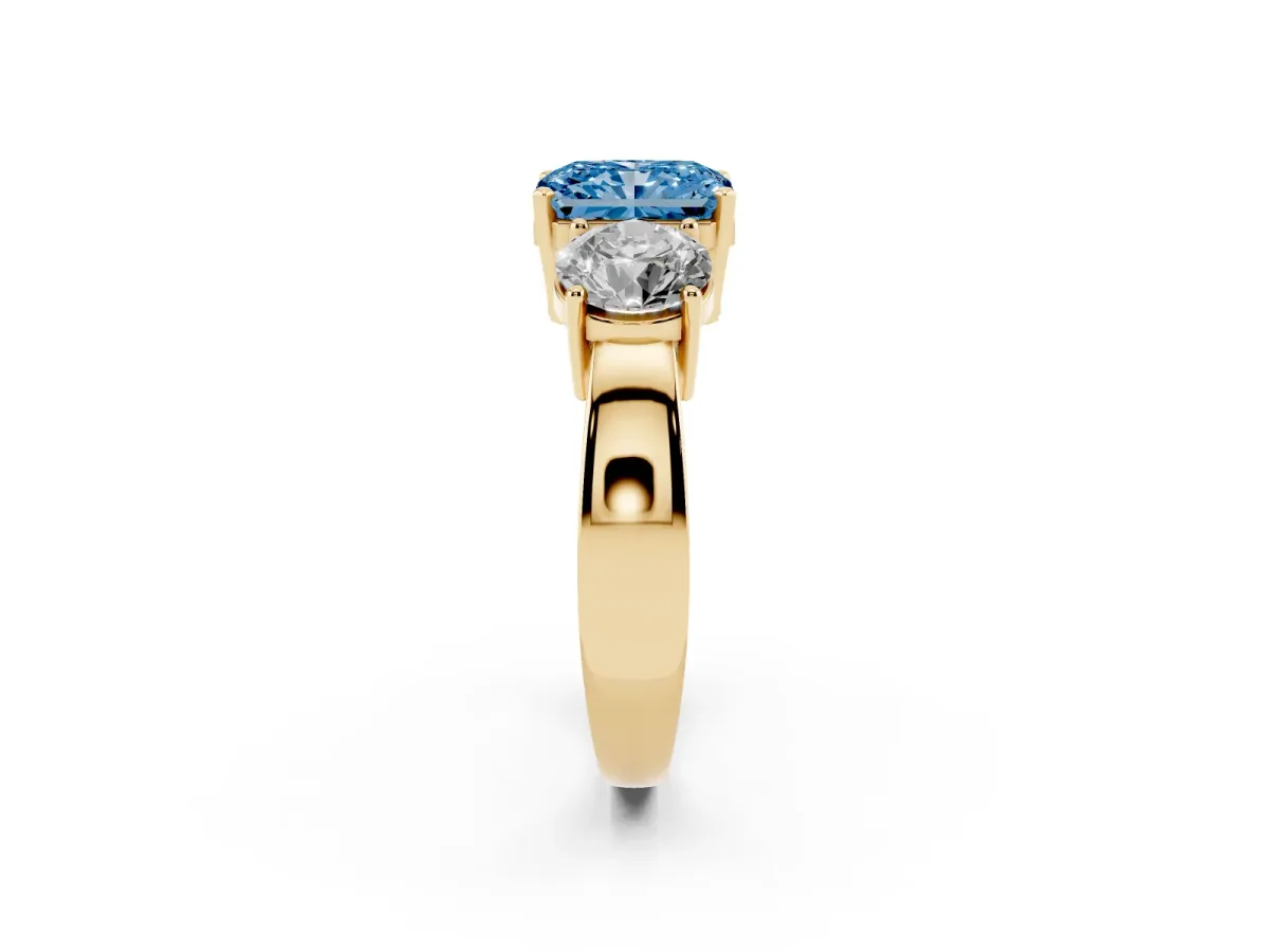 Fancy Blue Three-Stone Radiant Cut Diamond Ring with Round Side Stones, Classic Band, and Four-Prong Setting Yellow gold
