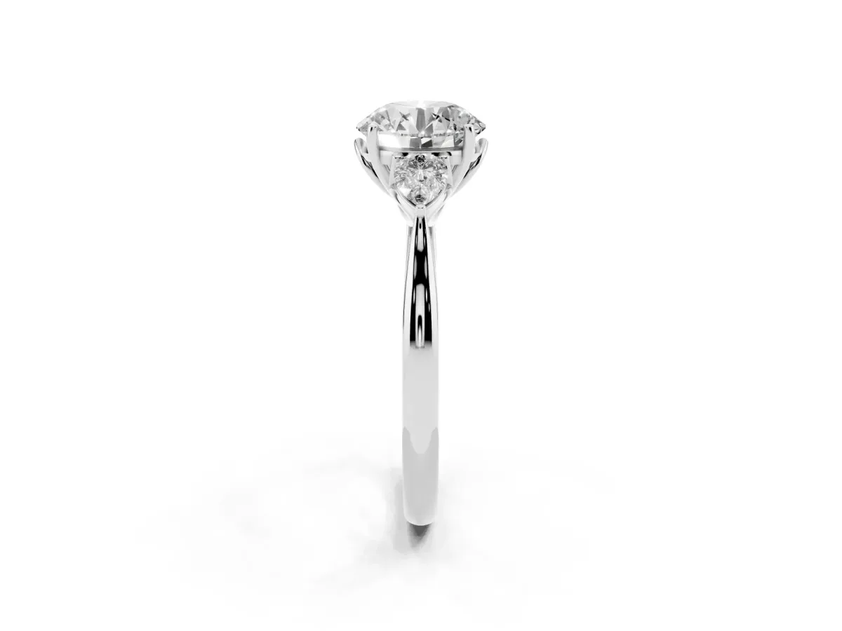 Three-Stone Round Cut Diamond Ring with Pear Side Stones in Four-Prong Setting Silver