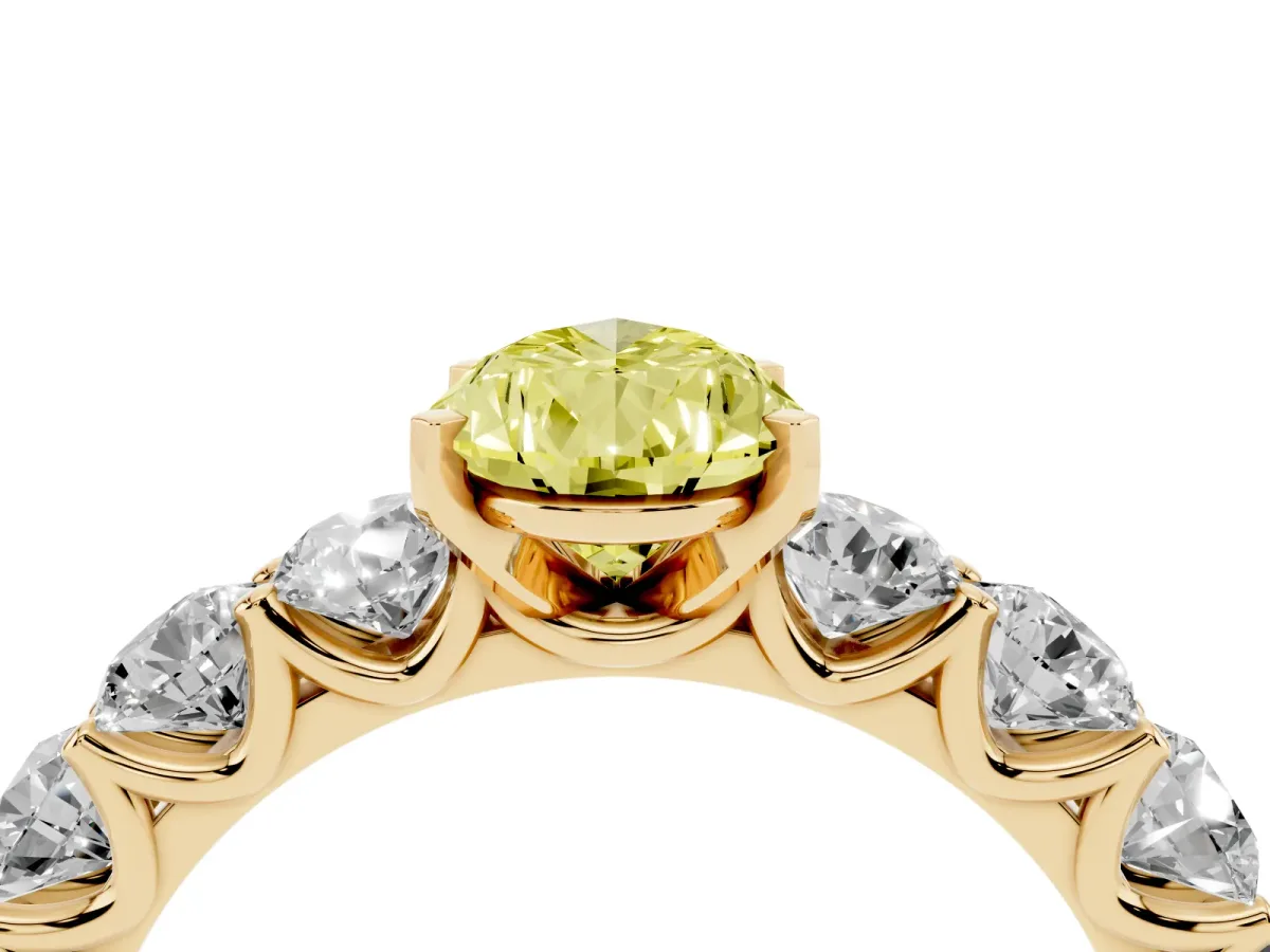 Fancy Yellow Pear Cut Diamond Prong Setting with Side Stones on a Pave Band Yellow gold