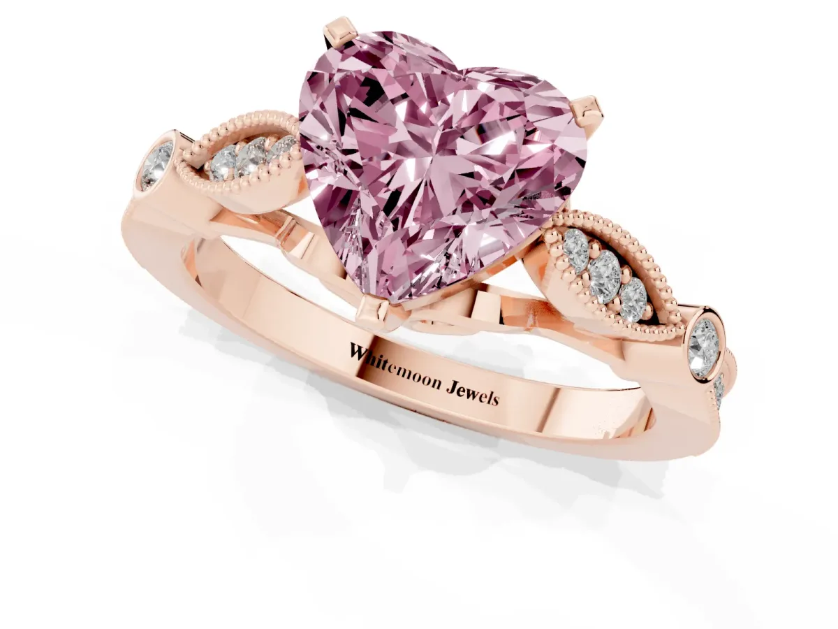 Fancy Pink Heart Cut Cut Diamond with Milgrain Marquise and Bezel Accents on a Solitaire Band with Prong Setting Rose gold