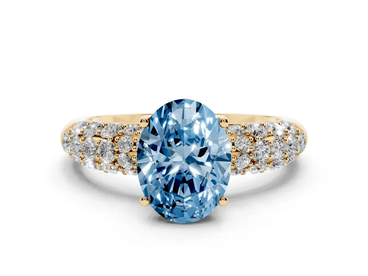 Fancy Blue Oval Cut Diamond Pavé Band Solitaire Ring with Four-Prong Setting Yellow gold