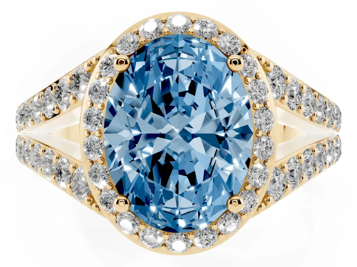 Fancy Blue Oval Cut Diamond Split Shank Halo Ring with Four-Prong Setting Yellow gold