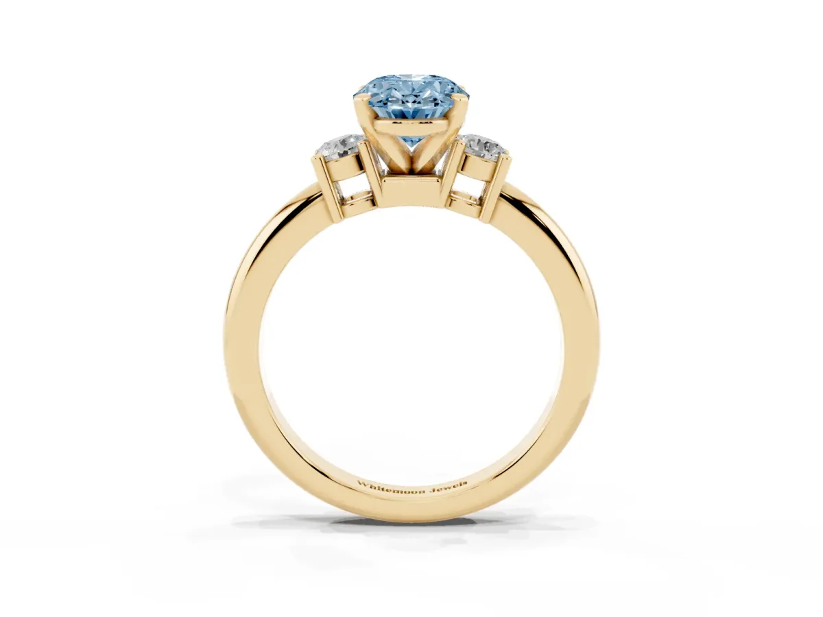 Fancy Blue Three-Stone Oval Cut Cut Diamond Solitaire with Prong Setting and Classic Band Yellow gold
