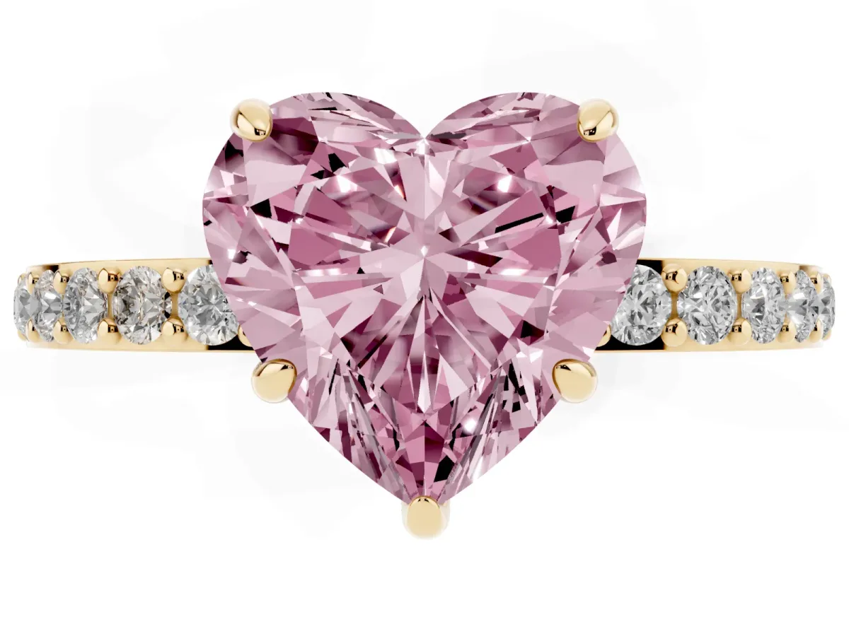 Fancy Pink Heart Cut Diamond Pavé Engagement Ring with Round Accents and Prong Setting Yellow gold