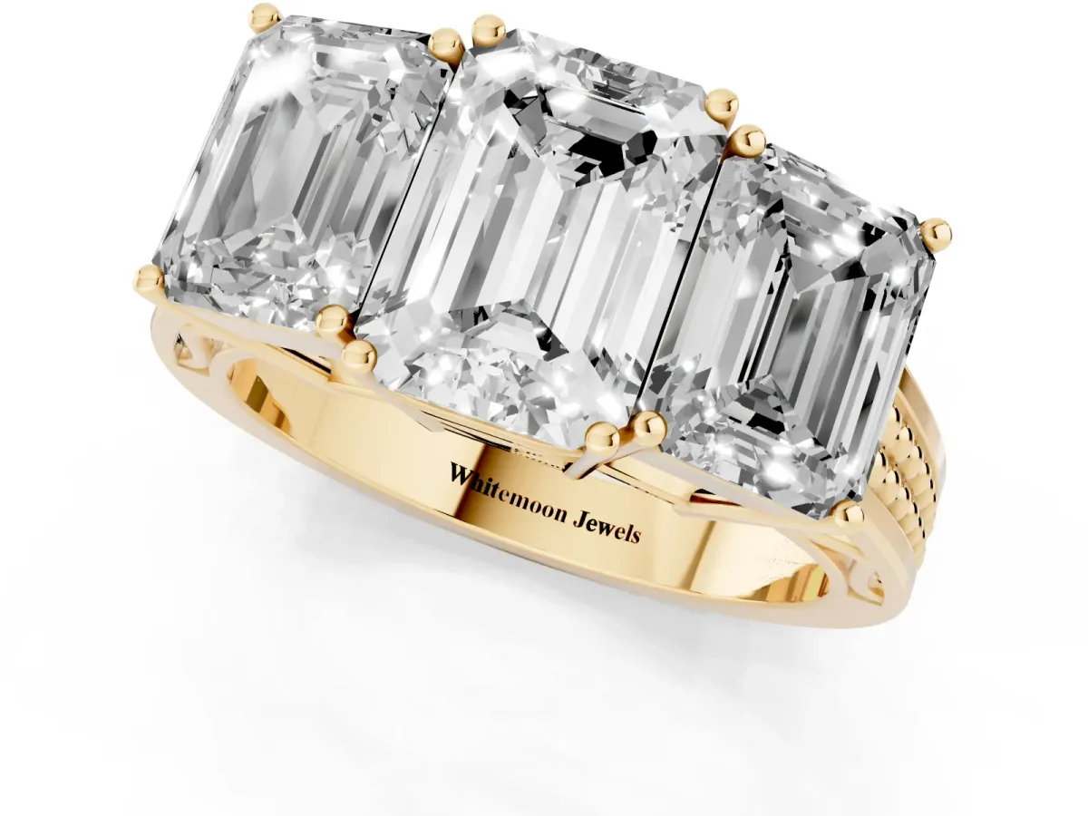 Emerald Cut Diamond Three-Stone Ring with Prong Setting and Textured Band Yellow gold