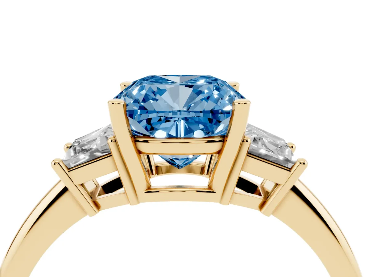 Fancy Blue Cushion Cut Diamond Three-Stone Ring with Trapezoid Side Stones and Prong Setting Yellow gold