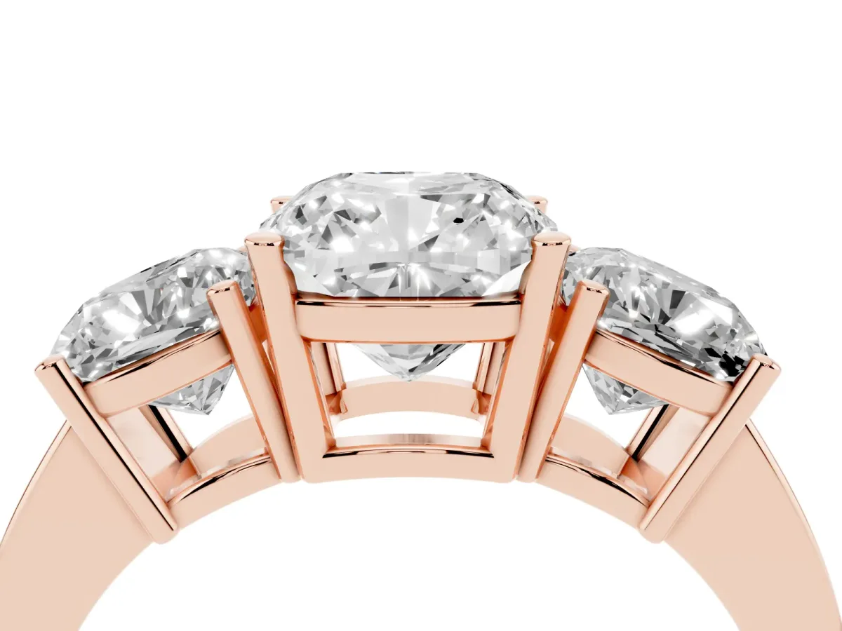 Three-Stone Cushion Cut Cut Diamond Engagement Ring with Flat Band and Four-Prong Setting Rose gold