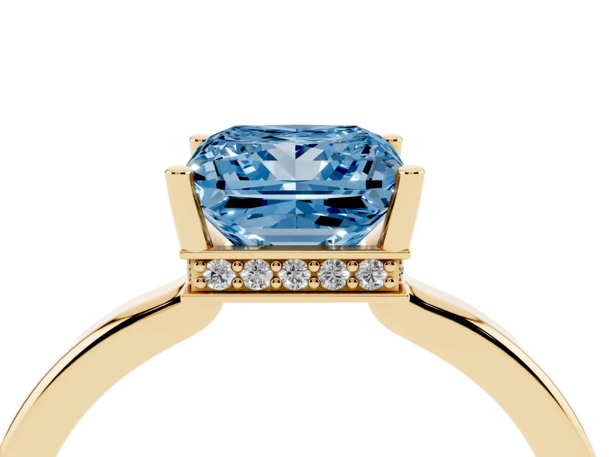 Fancy Blue Princess Cut Cut Solitaire Engagement Ring with Four-Prong Setting on a Classic Band Yellow gold