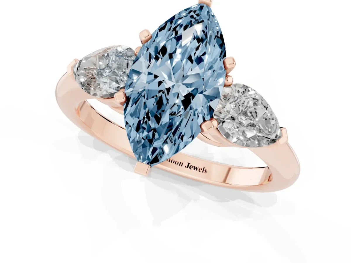 Fancy Blue Three-Stone Marquise Cut Diamond Ring with Pear Side Stones and Four-Prong Setting Rose gold