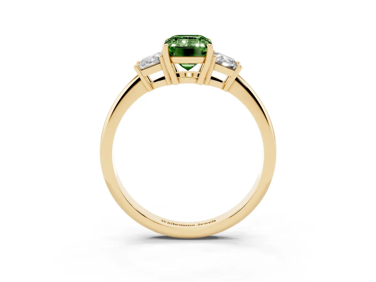 Fancy Green Emerald Cut Diamond Three-Stone Ring with Trapezoid Side Stones and Prong Setting Yellow gold