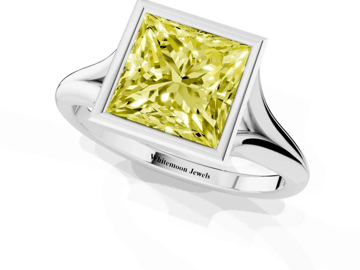 Fancy Yellow Bezel Set Princess Cut Cut Solitaire Ring with Tapered Band Silver