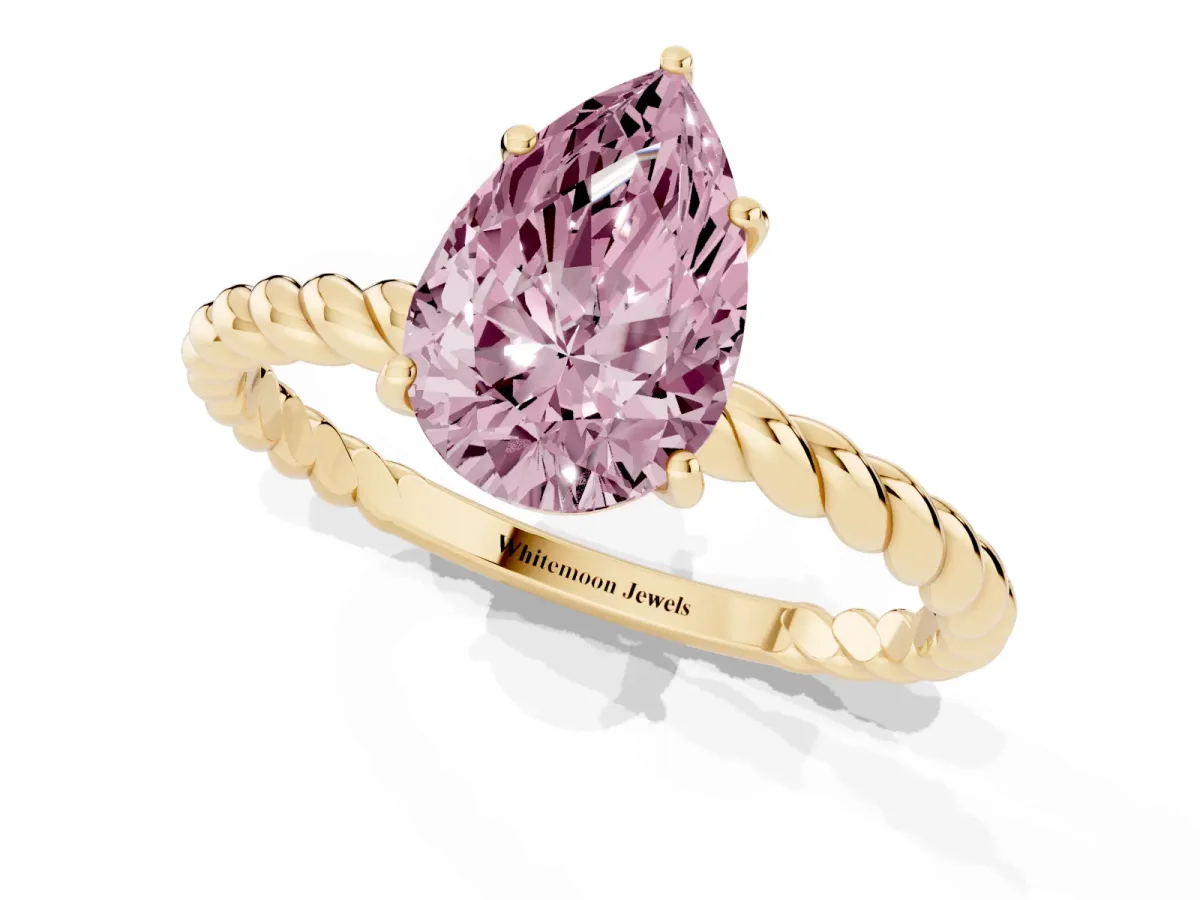 Fancy Pink Pear Cut Solitaire Twist Band Ring with Four-Prong Setting Yellow gold
