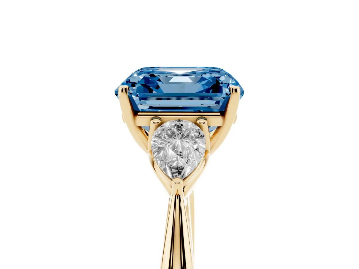 Fancy Blue Three-Stone Asscher Cut Brilliant Diamond Solitaire Ring with Tapered Band and Four-Prong Setting Yellow gold