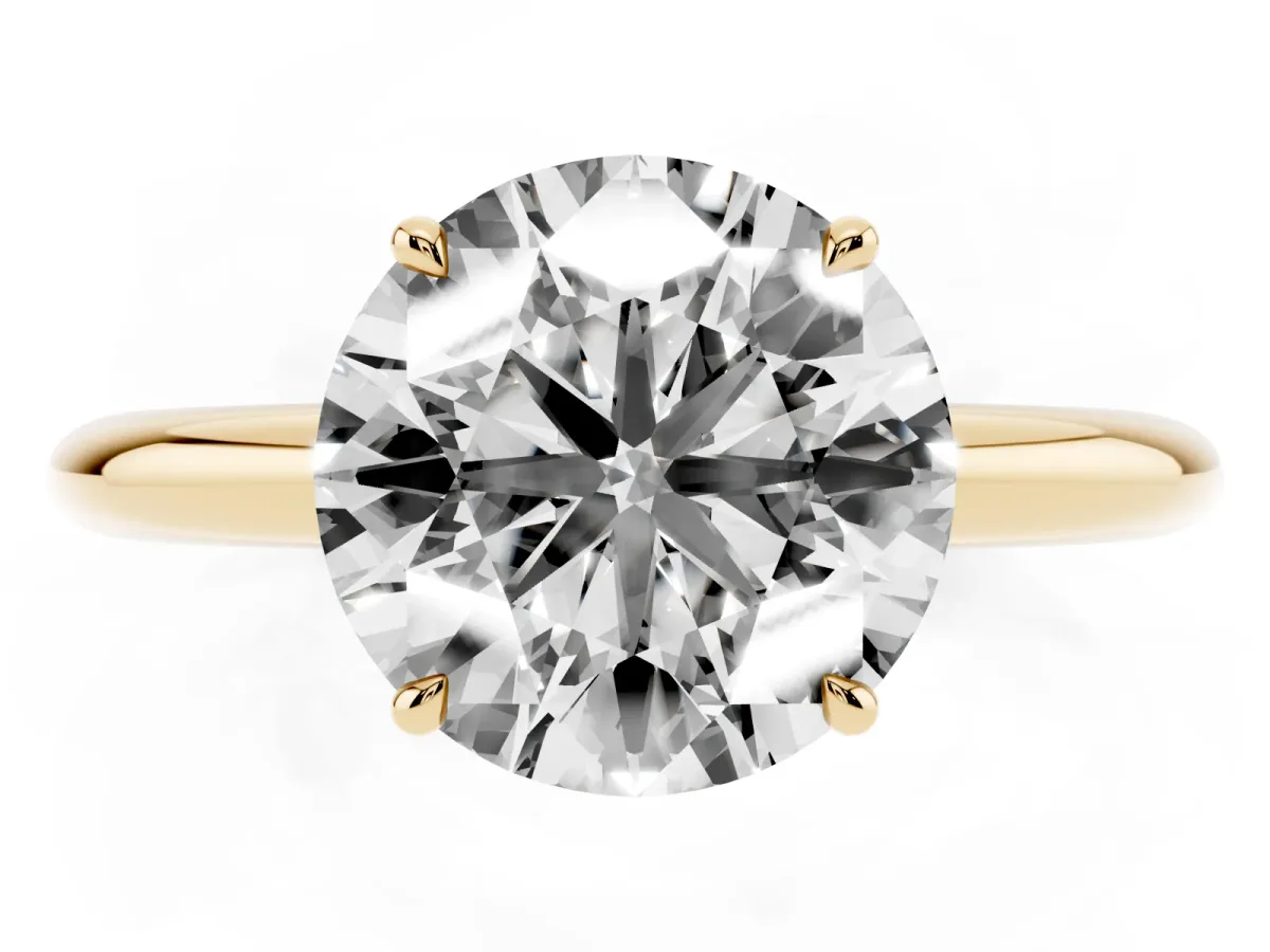 Round Cut Brilliant Solitaire Engagement Ring with Six-Prong Setting and Classic Band Yellow gold