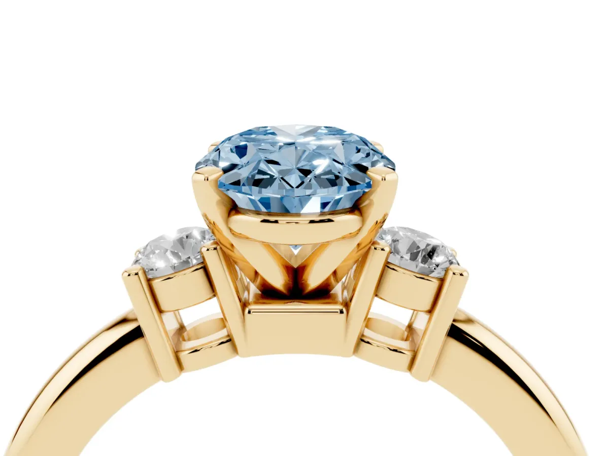 Fancy Blue Three-Stone Oval Cut Cut Diamond Solitaire with Prong Setting and Classic Band Yellow gold